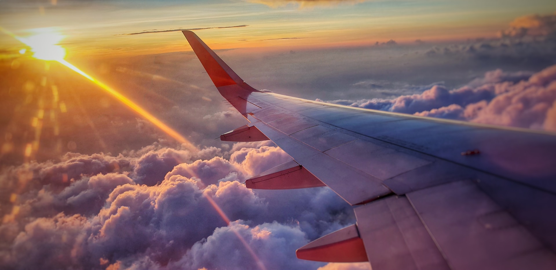 Airplane flying above clouds